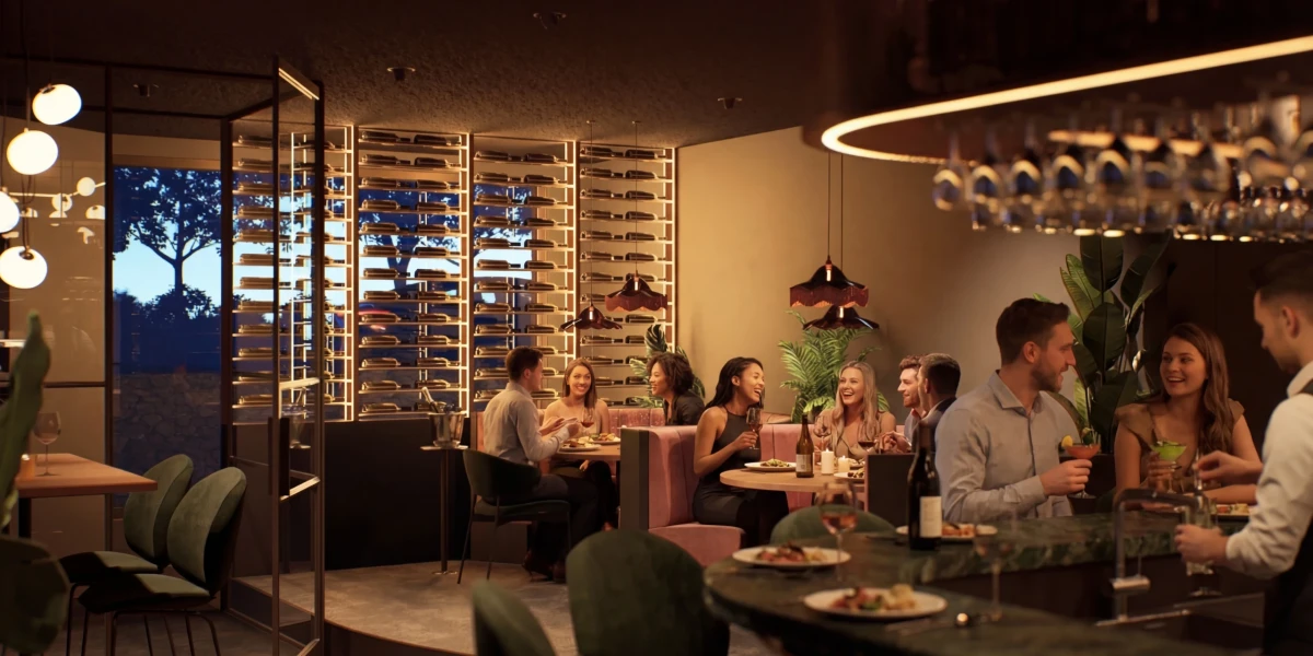 Gezellig interieur van restaurant Florizz in Zwijndrecht tijdens de avond, met gasten die dineren aan houten tafels tussen veel groen en sfeervolle verlichting.